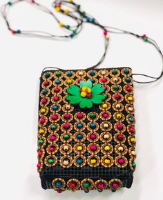 "Instant ethnic flare! Beautiful crossbow bag. 9\" X 7\". Strap is 20\" long. Made in Sierra Leone." Multicolor Handwork Rectangular Potli Bag, Traditional Black Rectangular Crochet Bag, Beaded Shoulder Bag For Festivals Gift, Handwoven Black Shoulder Bag For Festivals, Festival Handwoven Black Shoulder Bag, Black Handwoven Shoulder Bag For Festivals, Handmade Festival Pouch Bags, Multicolor Rectangular Potli Bag For Daily Use, Black Festive Bags For Festivals