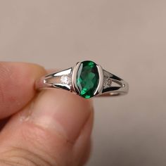 This is a gorgeous handmade creation. Its beauty is its simplicity & Elegance. The 6*8mm oval shape faceted lab emerald is crafted in solid sterling silver and with rhodium plated. All item is sent in a beautiful gift box If you have any idea of design your ring,pls contact me directly. You can realize more lovely stuff clicking the link https://www.etsy.com/shop/knightjewelry?refshopsection_shophome_leftnav Please leave the correct address and you phone number for delivering successfully. Oval Emerald Birthstone Ring In White Gold, Oval Emerald May Birthstone Ring, Oval Emerald Ring With Polished Finish, Oval Emerald Ring With Bezel Setting For Promise, Oval Emerald Ring With Birthstone, Emerald Oval Cabochon Ring For Anniversary & May Birthstone, Oval Emerald Birthstone Ring For May, Silver Emerald Rings With Oval Cabochon, Oval Solitaire May Birthstone Ring