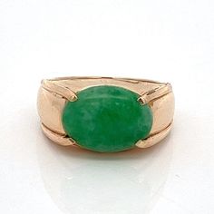 "Vintage Natural Green Jadeite Jade Oval 14k Yellow Gold Ring- Estate -Size 5.75 - ET1443 Discover timeless elegance with this exquisite Vintage Natural Green Jadeite Jade Oval Ring, set in 14k Yellow Gold, boasting a captivating estate design and ready to adorn a finger size 5.75 - a true gem for collectors. Metal Content: 14k Yellow Gold Ring Size: 5.75; this can be re-sized Gemstone: Jadeite Jade Cut: Oval Cabochon Size in mm: 12.20 x 9.18 x 3.10 Measurements: Face of Ring (North/South): 3/8\" (10mm) Height of ring off of finger: 6mm Ring shank width: tapers to 3mm Weight: 5.31 Grams Stamps: 585 Condition: Excellent Vintage Condition Each piece is thoroughly examined and refinished as needed by our professional jewelers, tested to guarantee metal content,  graded by our in-house GIA (Ge Formal Oval Jade Emerald Ring, Classic Green Cabochon Emerald Ring, Classic Green Cabochon Ring, Oval Jade Rings In Yellow Gold, Classic Green Emerald Oval Cabochon Ring, Classic Green Oval Cabochon Emerald Ring, Classic Jade Rings With Polished Finish, Classic Jade Rings For Formal Occasions, Classic Green Oval Jewelry