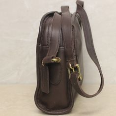 This lovely brown Coach crossbody bag measures approximately 7” x 9” x 3”. It is a used bag with minimal wear with a split seem on the interior. Please closely inspect all photos before purchasing. Closure: Zip Strap Drop: 15” Color: Brown Pockets: 1 Interior & 1 Exterior Material: Leather Style: Crossbody Bag Photos are Actual pictures, not stock photos. Authenticity Note: We have been trained to spot fake designer bags, and closely inspect each purse to verify authenticity. If we have any doub Classic Brown Flap Shoulder Bag, Formal Brown Saddle Bag With Adjustable Strap, Brown Crossbody Saddle Bag, Brown Shoulder Camera Bag With Removable Pouch, Classic Brown Saddle Bag With Removable Pouch, Coach Soft Leather Shoulder Bag, Brown Soft Leather Shoulder Camera Bag, Coach Rectangular Saddle Bag For Daily Use, Rectangular Coach Saddle Bag For Daily Use