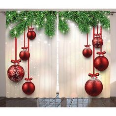 christmas decorations hanging from the side of a window in front of a curtain with lights