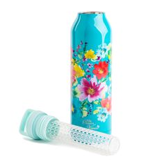 a blue water bottle with flowers on it and a straw in front of the bottle