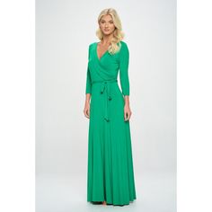 The Grace Wrap Dress is another West K's signature Maxi you will love! It has a fitted 3/4 sleeve and a faux wrap tie-waist detail in a full maxi length with wide bottom opening. This easy fit silhouette and comfort stretch will make this dress a favorite piece you'll want in every print. Made in USA. Machine washable. Green Maxi Length Wrap Dress With Tie Waist, Green Tie Waist Maxi Wrap Dress, Green Maxi Wrap Dress With Tie Waist, Green Fitted Maxi Dress With Surplice Neckline, Fitted Green Maxi Dress With Surplice Neckline, Fitted Wrap Dress For Spring, Fitted Green Belted Wrap Dress, Fitted Wrap Maxi Dress With Belt, Fitted Belted Wrap Maxi Dress