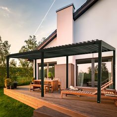 an outdoor deck with wooden benches and tables