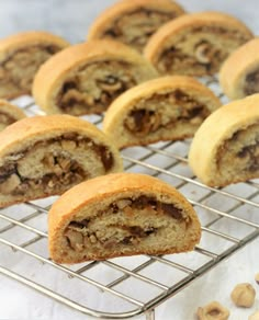 several pastries on a cooling rack with nuts