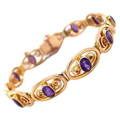 A Murle Bennett Art Nouveau 9 karat yellow gold amethyst bracelet A finely crafted 9 karat yellow gold bracelet of eleven articulated swirling segments each set to its centre with an oval cut amethyst of deep purple colour, for a total weight of 4.18 carats. Signed 'MB&Co' stamped 9ct The bracelet is secured with a push piece clasp together with an additional safety chain. Dimensions: 7.5 inches 0.7cm wide Condition Overall the condition of the bracelet is very good, with some slight abrasions t Yellow Gold Heart Necklace, Gold Flower Bracelet, Bijoux Art Nouveau, Bracelet Art, Art Nouveau Pendant, Retro Bracelet, Deep Purple Color, Purple Colour, Gold Heart Necklace