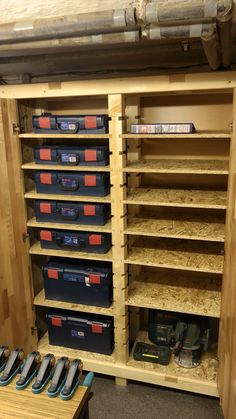 the shelves are filled with many different types of toolboxes and other storage bins