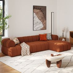 a living room filled with lots of furniture and decor on top of a wooden floor