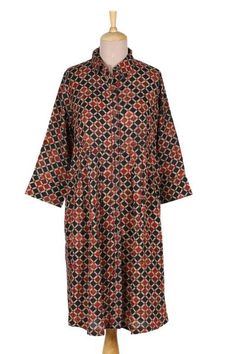 This bold geometric print shirtdress in paprika and black is from Indian designer Anchal Ahuja. The relaxed viscose dress features long sleeves a dropped waist and beading at the button placket and hem. Viscose Dress, Tunic Styles, Drop Waist, Cotton Pants, Indian Design, Geometric Print, Printed Cotton, Casual Button Down Shirt, Paisley