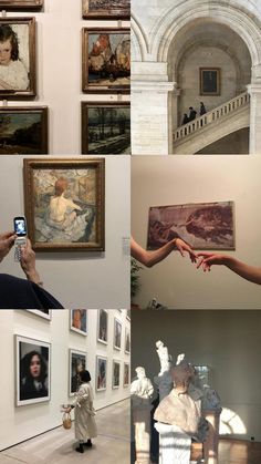 people taking pictures of paintings on display in an art gallery