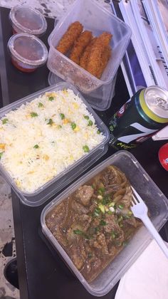 three plastic containers filled with food sitting on top of a table next to drinks and utensils