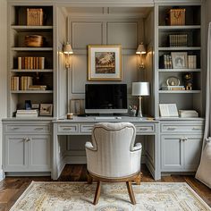 a home office with built - in bookcases, desk and chair