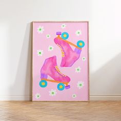 a pink painting with roller skates painted on it's side in front of a white wall