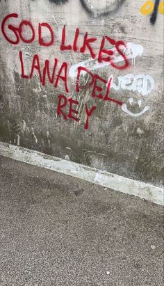 Old concrete wall spray painted with the words “God likes lana del rey” in thin red. Grunge Lana Del Rey Aesthetic, Coquette Lana Del Rey Core, Lana Aesthetic Core, Lana Del Rey Aesthetic Quotes, Lana Wallpaper Aesthetic, Lana Del Ray Core, Lana Del Rey Aesthetics, Lana Del Rey Aesthetic Wallpaper, Lana Del Rey Core