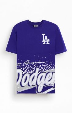 The New Era LA Dodgers Sport Class T-Shirt offers a nod to retro sports style. With a crew neckline, short sleeves, and vintage-inspired LA Dodgers graphics at both the left chest and hem, it’s a classic choice for fans of timeless design.Solid color teeShort sleevesCrew necklineLA Dodgers graphicsStandard fitMachine washable New Era Mens LA Dodgers Sport Class T-Shirt - Blue size Medium Streetwear Graphic T-shirt For Baseball Season, Throwback Crew Neck Fan Merchandise Tops, Retro Sports T-shirt With Graphic Print, Blue Sublimation Print Tops For Baseball Season, Collegiate Crew Neck T-shirt For Streetwear, Blue Graphic Tops For Baseball Season, Blue Crew Neck T-shirt For Sports Season, Vintage Short Sleeve T-shirt With Lettering, Throwback Crew Neck Top For Sports Season