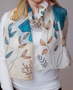 Floral Motif Silk Scarf is a luxury and unique giht for her! This batik scarf is hand painted.  ANOLI Design hand painted silk scarves are an outstanding and unique gift for those who want to stand out from the gray mass! Our designs are characterized by a unique symbiosis of a beautiful and modern lifestyle. Anoli Design products are like a sensual embodiment of lightness, beauty and ultimate comfort, with which you enjoy timeless luxury  intertwined with the best emotions and unique memories. Silk Scarves With Floral Print As Gift, Silk Scarf With Floral Print For Gift, Silk Floral Print Scarf As Gift, Silk Scarves With Floral Print For Gift, Floral Print Silk Shawl Scarf As Gift, Floral Print Silk Shawl Scarf For Gift, White Bohemian Silk Scarf With Floral Print, Silk Floral Print Shawl Scarf, Artistic Silk Scarf With Floral Print