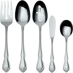 an assortment of silverware including spoons, forks and knives with designs on them