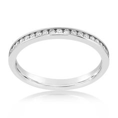 a white gold wedding band with channeled diamonds on the side, set in 18k white gold