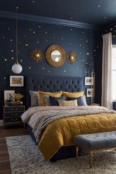 a bedroom with blue walls and gold accents