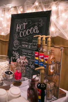 a hot cocoa bar is set up on a table