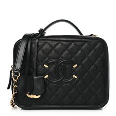 This is an authentic CHANEL Caviar Quilted Large CC Filigree Vanity Case in Black. This chic stylishtravel bag is crafted of luxurious diamond quilted caviar leather in gold. This elegant shoulder bag featuresan gold chain link leather threaded shoulder strap and a large Chanel CC stitched logo on the front. The two zippers open all around to a partitioned black leather interior with zipper and flat pockets and a holder for a mirror. Stylish Travel Bag, Chanel Shoulder Bag, Vanity Case, Leather Thread, Chanel Caviar, A Mirror, Diamond Quilt, Leather Interior, Chanel Bag