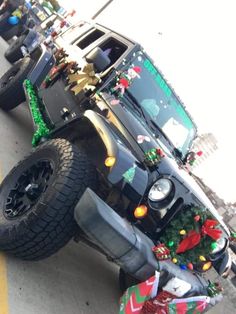 a jeep decorated with christmas decorations and presents is parked on the side of the road