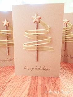 three greeting cards with christmas trees on them