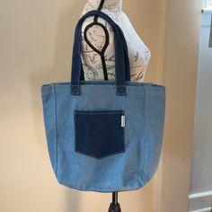 Brand New, No Tags. Light And Dark Denim. 14 In Tall And 17 Inches Across. Comes From Smoke Free And Pet Free Home. Denim Blue Shopping Bag With Pockets, Shopping Shoulder Bag In Denim Blue With Pockets, Denim Blue Shoulder Bag With Pockets For Shopping, Everyday Denim Tote Bag, Denim Blue Shopping Bags In Denim Material, Denim Blue Shopping Bags Made From Denim, Denim Blue Shopping Bags Made Of Denim, Blue Denim Bags With Pockets, Casual Blue Shoulder Bag For Everyday Use