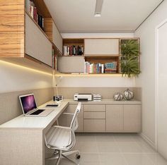 a computer desk with a laptop on top of it in front of a book shelf