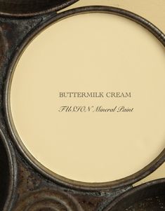 a close up of a plate on a table with writing in the center that says buttermilk cream