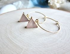 "Gorgeous and alluring in beautiful pale shades of rosy pink, these 14k gold plated rose quartz triangle hoops are sure to get noticed. ★Hoops- High Quality Gold Fill Hoops ★Stone-Genuine Rose Quartz, electroplated in 14k gold ★Dimensions- Hoops are 1\" in diameter. Triangles are 10mm per side ★We want you to love your new jewelry and gladly accept returns. ★Arrives ready for gifting (example in last photo) and usually ships same day or next day. Check shop announcement for occasional delays. Ea Pink Minimalist Hoop Earrings For Gift, Pink Minimalist Hoop Earrings Gift, Pink Minimalist Hoop Earrings, Minimalist Pink Hoop Earrings For Pierced Ears, Pink Triangular Jewelry For Gifts, Pink Triangle Jewelry For Gifts, Pink Triangle Jewelry For Gift, Quartz Hoop Earrings, Pink Crystal Earrings