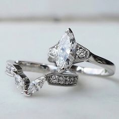 three engagement rings with diamonds on them