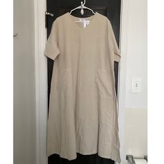 Linen Blend Dress, One Size Fits All. Never Worn! In Perfect Condition But I Was Too Lazy To Steam! :) No Longer Sold Online. Pit To Pit Measurement 22.75”, Length From Shoulder To Hem 46”. Neutral Short Sleeve Midi Dress For Beach, Neutral Short Sleeve Maxi Dress For Summer, Neutral Short Sleeve Summer Maxi Dress, Neutral Short Sleeve Midi Dress For Daywear, Beige Short Sleeve Summer Maxi Dress, Overall Jumper, Sheer Midi Dress, Linen Blend Dress, Black Short Sleeve Dress