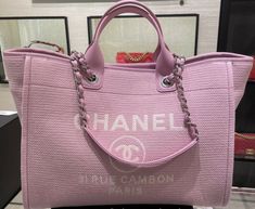 CHANEL Deauville Tote Pink color with white letters  Silver Hardware  Can be used 2 ways, with handles and straps  CHANEL Rue Cambon PARIS on front of the handbag  great bag for traveling  Comes with a detachable zippered pouch that can be used as a wallet or pouch  11.7 × 19.5 × 8.6 in New with tags, box, authenticity card, ribbon, etc   (everything i received from chanel store)  Can show receipt for authenticity. Chanel Tote Bag 2022, Pink Wallpaper Shopping Bag, Large Luxury Shopping Bag, Luxury Canvas Shoulder Bag For Shopping, Luxury Canvas Shopping Bags, Chanel Shopper, Pink Chanel Bag, Chanel Tote Bag, Luxury Tote Bags