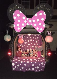 the back of a car decorated with minnie mouse decorations