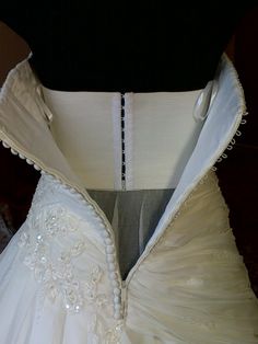 the back of a wedding dress on display