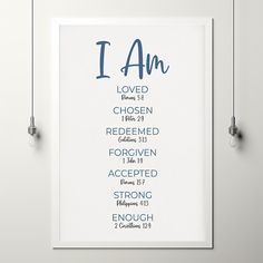 a white framed poster with the words i am and ten commandments in blue ink