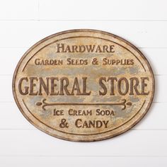 a sign on the side of a building that says general store ice cream soda and candy