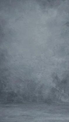 an abstract painting with grey and black colors on the wall, in front of a dark gray background