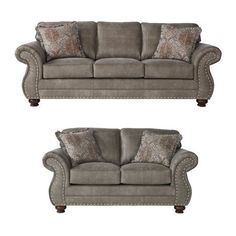 two gray couches with pillows on them