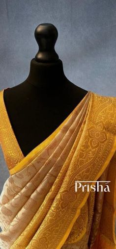 Gold Katan tissue silk saree with copper zari floral pattern weaving all over the body of the saree. The saree has a yellow contrast border and pallu with intricate copper zari weaving.  Blouse: Yellow brocade material  [Unstitched] Please note there may be slight colour variations due to lighting. please send us a message if you want blouse material separated  and need pico ( no extra charge) Transitional Gold Banarasi Silk Pre-draped Saree, Gold Brocade Pre-draped Saree With Zari Weaving, Elegant Yellow Pre-draped Saree With Zari Weaving, Transitional Yellow Tissue Silk Pre-draped Saree, Gold Banarasi Silk Pre-draped Saree With Pallu, Yellow Katan Silk Saree Blouse Piece, Yellow Katan Silk Blouse For Puja, Yellow Katan Silk Blouse Piece For Puja, Elegant Orange Pre-draped Saree For Festivals