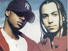 two young men with dreadlocks standing next to each other