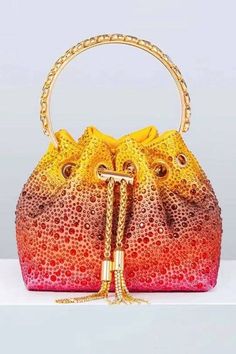 Love the Harlow Multicolored Crystal Embellished Bucket Bag for all occasions! This bag is made of PU material, and the surface is inlaid with hot diamonds. The chain allows you to straddle your body diagonally. The handle on the top makes it easy to carry it anywhere. This is a great accessory choice whether worn with dresses or casual looks.  Material: PU  One Size fits all Length/Width/Height：15*10*13cm Weight：0.57kg  Colour may vary due to lighting on images Orange Purse, Adjustable Strap Bag, Soft Leather Handbags, Instagram Baddie, Bucket Purse, Boutique Style Outfits, Bucket Handbags, Crystal Clutch, Beautiful Handbags