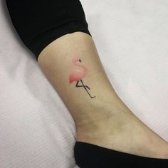 a small flamingo tattoo on the ankle