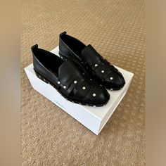 This Stunning Phillip Lim Black Leather Studded Loafers Are The Perfect Loafer For This Autumn. They Are Perfect For Adding A Classic Temporary Edge To A Normal Outfit. Pair With Blue Ankle Jeans And A White Cashmere Sweater. White Cashmere Sweater, Studded Loafers, Ankle Jeans, 3.1 Phillip Lim, Phillip Lim, Cashmere Sweaters, Loafer Flats, Flat Shoes Women, Blue Black