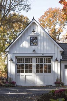 a white two car garage with windows on the side