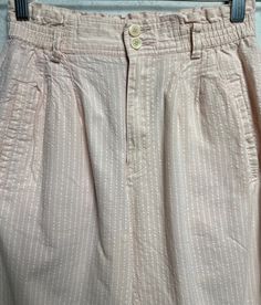 Retro striped pants in light pink color with textured striping. Pants feature a high elastic waistband with five belt loops and double-button closure above a zipper fly. Pants are pleated and include two side pockets and one rear pocket with single button closure. There is a hidden button closure on the front. This item is listed as a womens S and is in excellent vintage condition with no holes or stains noted. Spring Striped Bottoms With Belt Loops, Striped Spring Pants With Belt Loops, Spring Striped Pants With Belt Loops, Spring Pink Bottoms With Belt Loops, Striped Tapered Leg Bottoms For Spring, Light Pink Pants, Pastel Sweater, Plaid Blouse, Light Pink Color