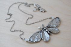 Here is an amazing large silver moth necklace, which is truly a work of art.♥ The Moth has a wingspan measuring at about 3.25 inches wide♥ Solid silver pewter, highly 3 dimensional with wonderful detail♥ Your choice color of crystal accent beads (White Opal shown in photos)♥ This necklace comes gift packaged Be sure to check out our shop for more jewelry inspired by the Land, Sky & Sea:http://www.EnchantedLeaves.Etsy.com Witch Moth, Moth Pendant, Cottagecore Witch, Moth Necklace, The Moth, Necklace Cute, Insect Jewelry, Leaf Jewelry, Nature Jewelry