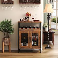 a wooden cabinet with wine glasses and bottles on it