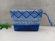 Boho Handmade Makeup Pouch Color: Blue and White Notes: The patterns on the pouch are not exactly the same due to the cut of the fabric. We will choose the pattern randomly for you, or if you want to select specifically, please send us a message !! Details: - The front and back of the pouch are made of cotton, dyed naturally into this indigo blue color. The tribal patterns are printed using block printing technique. - The size of the pouch makes it convenient for you to store makeups or small st Blue Rectangular Cosmetic Bag For Daily Use, Blue Portable Pouch Cosmetic Bag, Portable Blue Pouch Cosmetic Bag, Portable Blue Pencil Case Pouch, Blue Rectangular Pouch For Daily Use, Rectangular Blue Pouch For Daily Use, Blue Cosmetic Pouch Bag For Personal Use, Blue Zipper Pouch For Daily Use, Blue Pencil Case Pouch For Daily Use